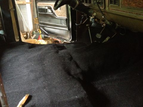 1979 Ford Bronco - Interior view of a 1979 Ford Bronco after new black carpet installation.