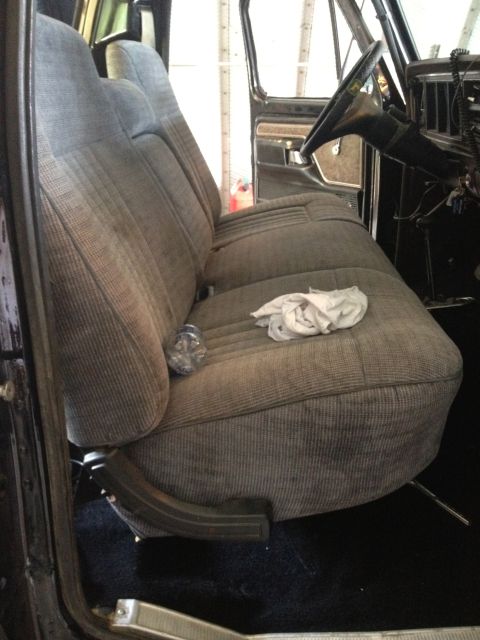 1979 Ford Bronco - Interior view of a vehicle's bench seat and dashboard area.