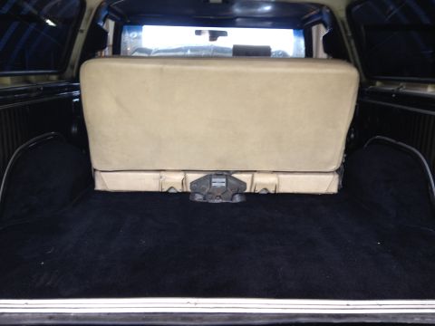 1979 Ford Bronco - Rear cargo area of a 1979 Ford Bronco with the back seat folded flat.