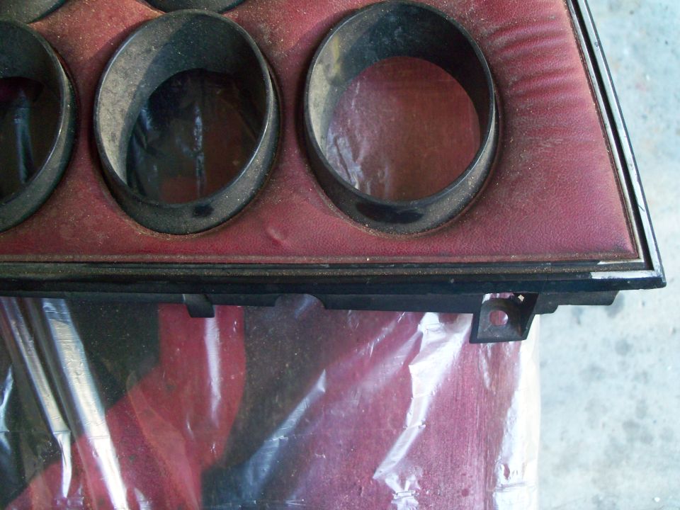 Typical condition of 30   year old interior gauge cluster trim panel. Note the silver trim paint has deteriorated to the point of almost being gone.