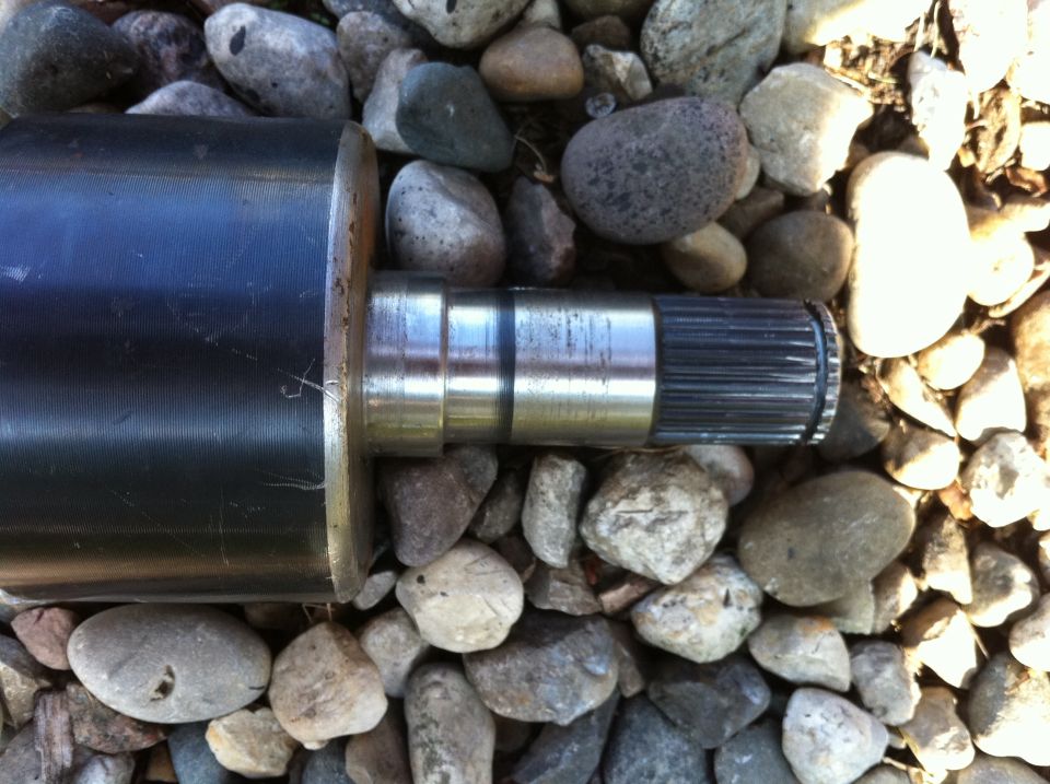 Close-up of axle shaft with splines on one end