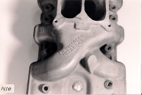 1973 Ford Mustang - Close-up of an aluminum intake manifold showing stamped firing order and part numbers.