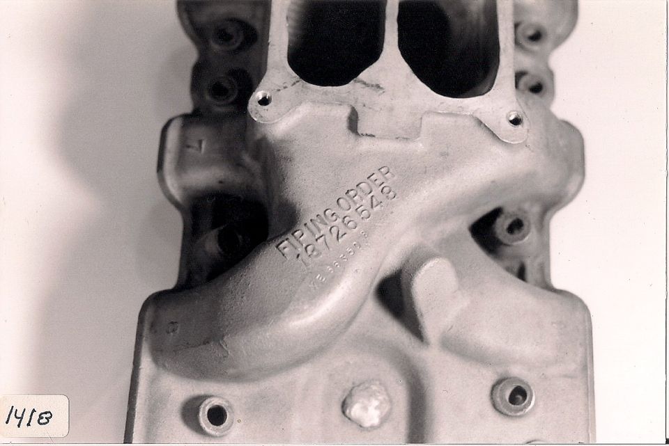 Aluminum intake manifold with 'FIRING ORDER 18726543' stamped on it
