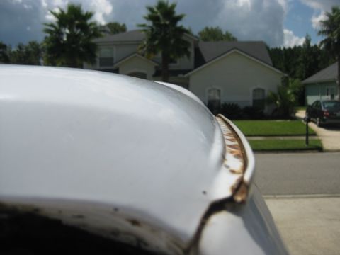 1994 Ford Bronco - Rust is visible on the trim of this white vehicle's roofline.