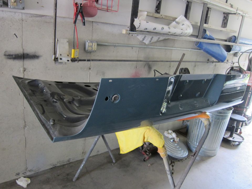 Car door on a stand in a garage