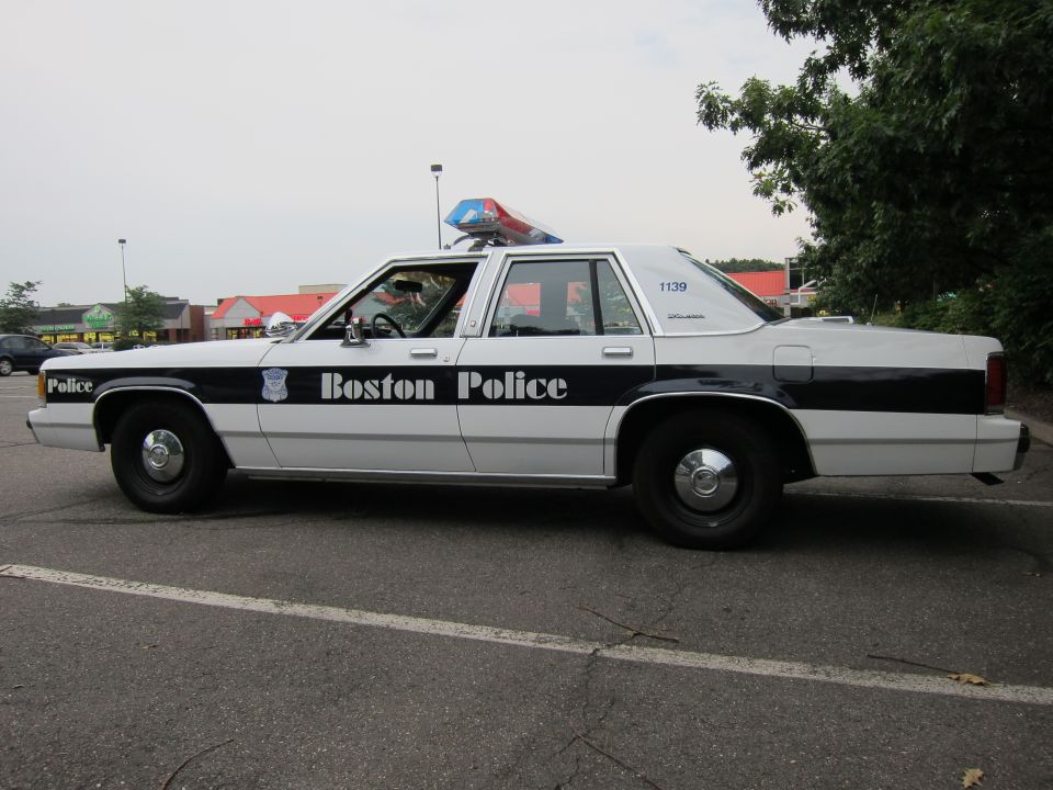 Side view of a 1991 Ford Crown Victoria LTD police car with 'Boston Police' on the door