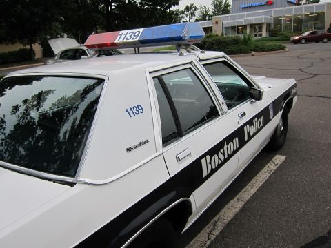 1991 Ford LTD Crown Victoria - Side view of a 1991 Ford Crown Victoria LTD marked as a Boston Police vehicle.
