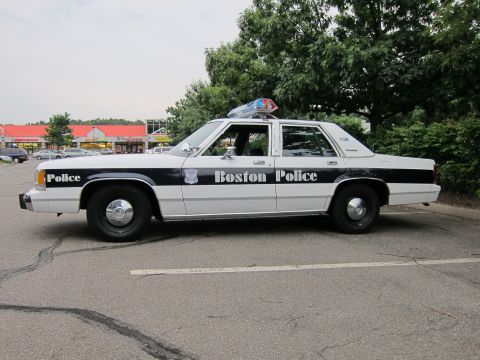 1991 Ford LTD Crown Victoria - Side view of a 1991 Ford Crown Victoria LTD marked as a Boston Police vehicle.