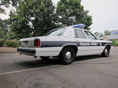 1991 Ford LTD Crown Victoria - This 1991 Ford Crown Victoria police car features a distinctive black stripe and "Boston Police" lettering on its side.