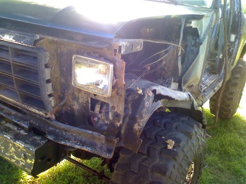 1990 Ford Bronco - This 1990 Ford Bronco shows significant rust and damage to its front end, including the grille and fender.