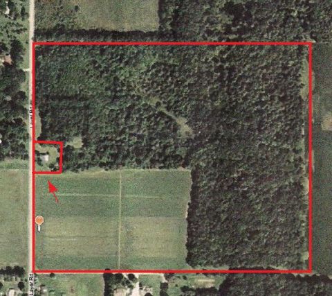 1973 Ford Mustang - Aerial view of a rural property with a house, woods, and agricultural fields, outlined in red.