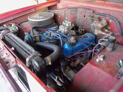 1968 Ford Bronco - View of the engine bay, blue valve covers and an aftermarket air filter.
