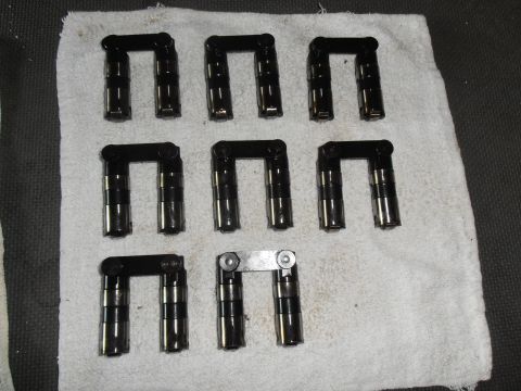 1990 Ford Bronco - A collection of engine lifters are laid out on a white towel, ready for installation or inspection.