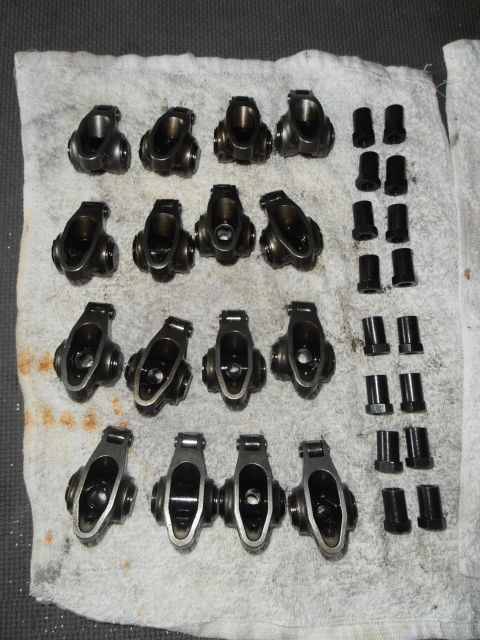 1990 Ford Bronco - Engine rocker arms and pushrods are neatly arranged on a white cloth for inspection.