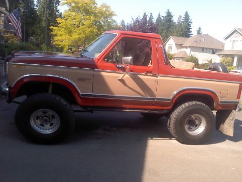 1984 Ford Bronco - This two-tone Ford Bronco features a lifted suspension and appears to be from the early 1980s.