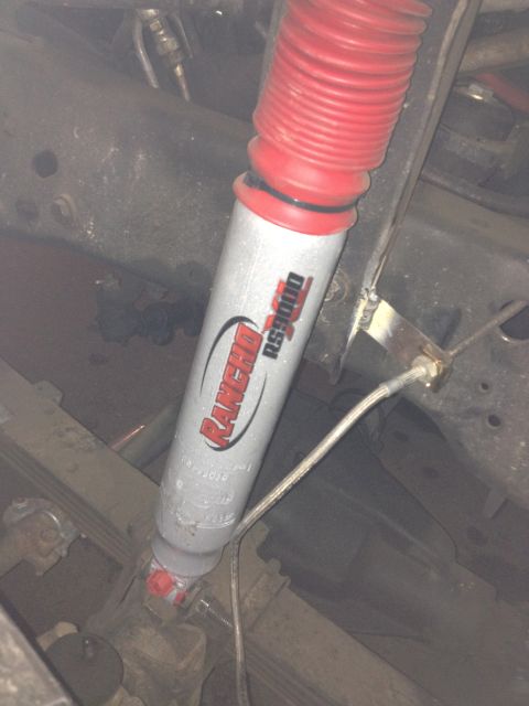 1984 Ford Bronco - Close-up of a Rancho RS9000 shock absorber, part of a vehicle's suspension system.