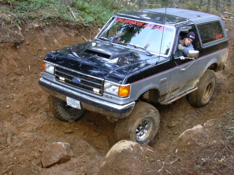 1991 Ford Bronco - Ford Bronco tackling a challenging off-road course.