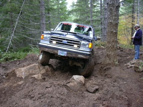 1991 Ford Bronco - This 1991 Ford Bronco tackles a challenging off-road course with steep inclines and obstacles.