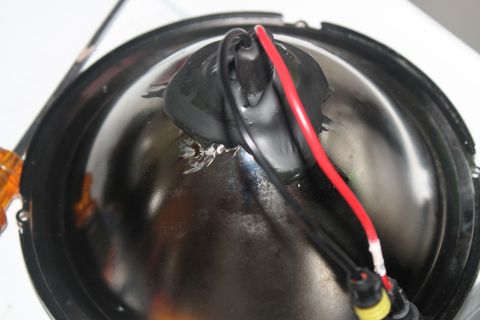 1990 Ford Bronco - Close-up view of a headlight assembly, showing wiring connections.