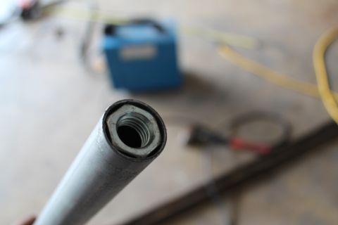 1990 Ford Bronco - Metal tube with a threaded insert, likely a component for a custom build.