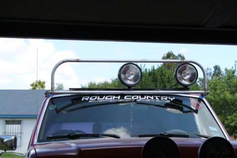 1990 Ford Bronco - Front view of a 1990 Ford Bronco equipped with a light bar and off-road lights.