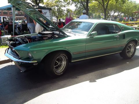 1970 Ford Ranchero - 1969 Ford Mustang Mach 1 displayed with its hood open, revealing the engine compartment.