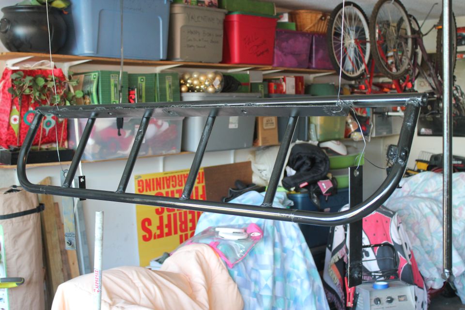 Black light cage hanging in garage