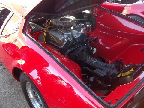 1970 Ford Ranchero - Close-up of a red sports car's engine bay, showing the V8 engine and air intake system.