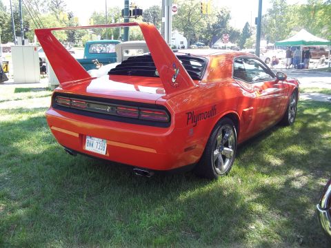 1970 Ford Ranchero - Orange Plymouth Superbird replica with distinctive rear wing and louvers on the back window.