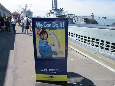 1991 Ford LTD Crown Victoria - A sign for the USS Pampanito submarine is displayed at a waterfront attraction.