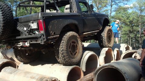 1992 Ford Bronco - This 1992 Ford Bronco navigates an obstacle course made of large concrete pipes.