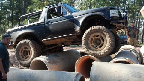 1992 Ford Bronco - This modified 1992 Ford Bronco is navigating an obstacle course made of concrete pipes.
