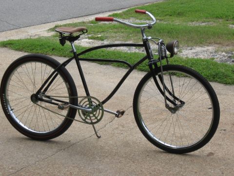 1994 Ford Bronco - This vintage bicycle features a classic frame, a spring fork, and a headlight.
