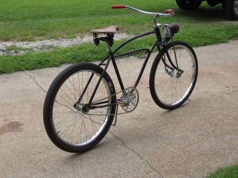 1994 Ford Bronco - A custom bicycle with a vintage aesthetic is parked on a concrete surface.
