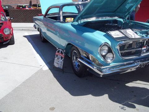 1970 Ford Ranchero - This 1962 Chrysler 300 is displayed with its hood open, revealing the engine and informational materials.
