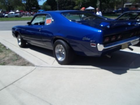 1970 Ford Ranchero - This blue 1970 Ford Ranchero GT coupe is seen from the rear, its classic body style and chrome wheels.