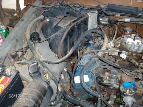 1979 Ford F-150 - Close-up view of an engine bay with various components and wiring visible.