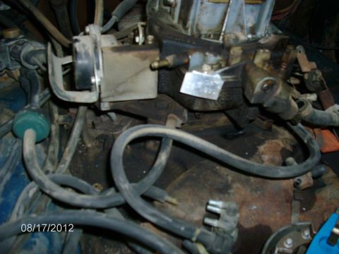 1979 Ford F-150 - Close-up view of engine components, including the carburetor and fuel lines, with a date stamp of 08/17/2012.