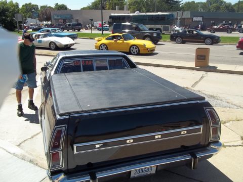 1970 Ford Ranchero - Black 1970 Ford Ranchero pickup truck seen from the rear with a tonneau cover and "FORD" badging.