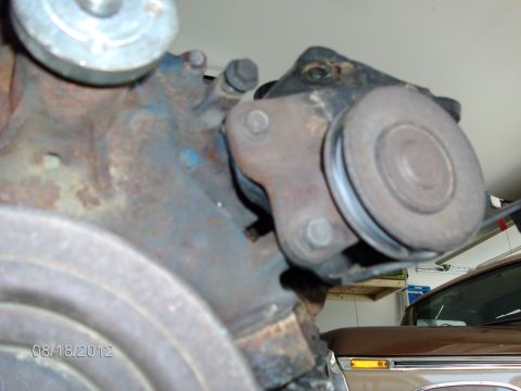 1979 Ford F-150 - Close-up of a rusty engine component, possibly from a Ford F-150, with a visible date stamp.