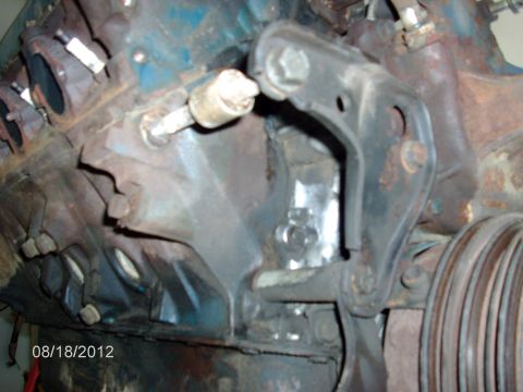 1979 Ford F-150 - Close-up view of an engine block, showing spark plugs and a metal mounting bracket. The date 08/18/2012 is visible in the corner.