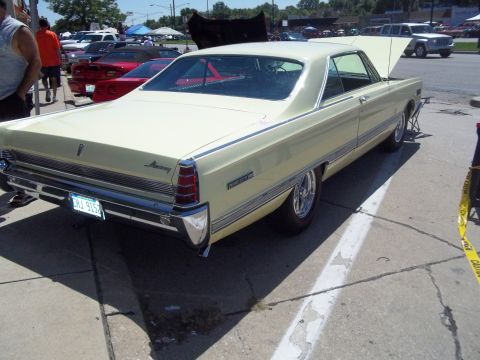 1970 Ford Ranchero - A classic Mercury Monterey is displayed at an outdoor car event, with other vehicles also present.