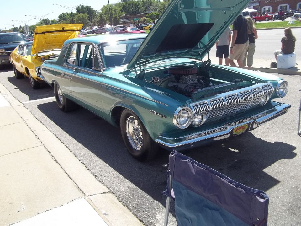 Teal 1963 Dodge Polara with hood open, parked on street