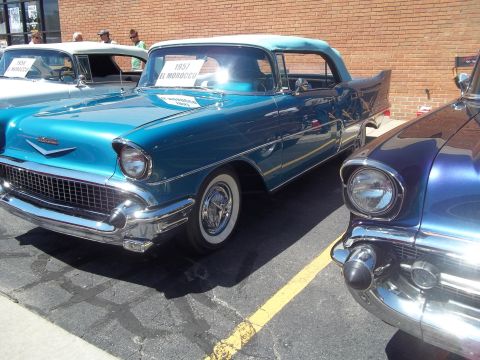 1970 Ford Ranchero - Two classic American cars, a blue 1957 El Morocco and a purple car, are parked next to each other.