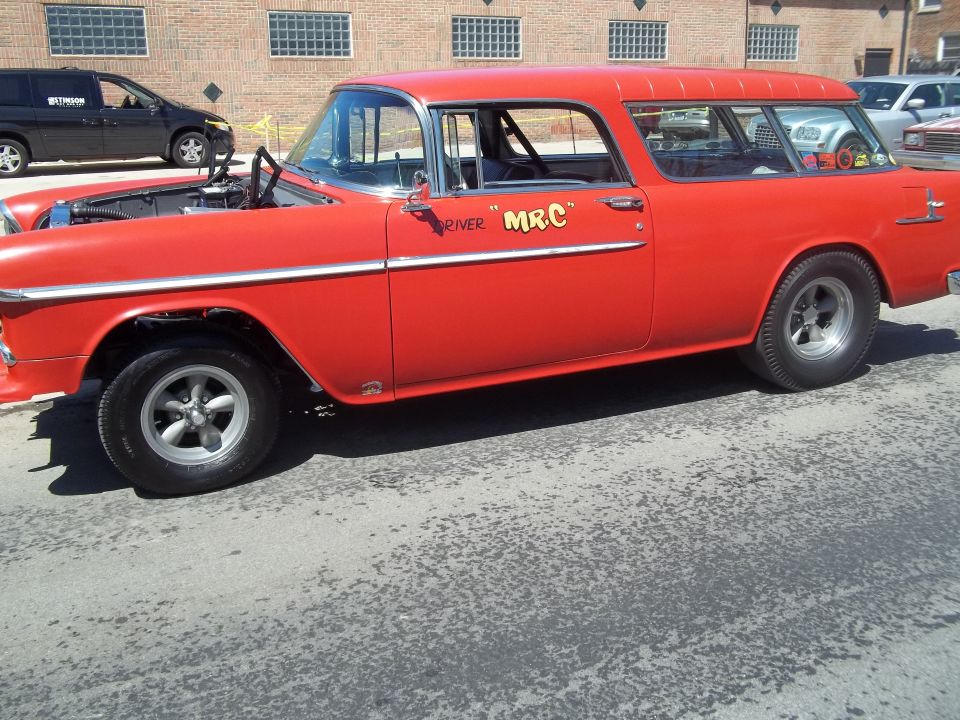 Red 1955 Chevrolet Nomad station wagon with "RIVER" and "MR.C" lettering on the door