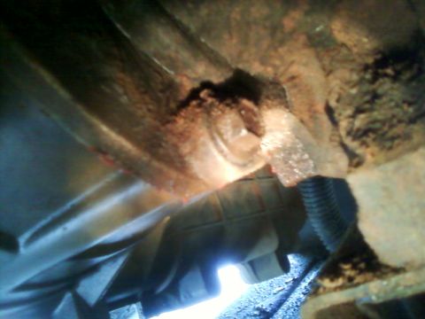1996 Ford Bronco - This photo shows a close-up view of a damaged vehicle transmission housing, possibly indicating a crack.