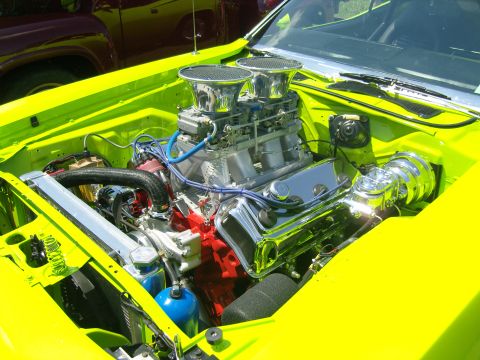 2007 Ford Mustang - Custom engine bay dual carburetors and a bright yellow exterior.