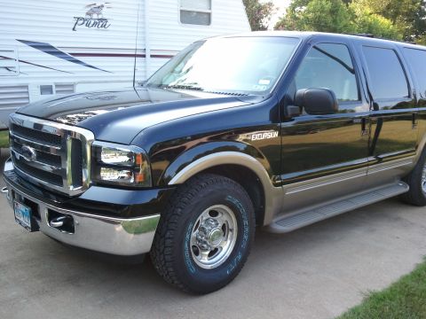 2001 Ford Excursion - This 2001 Ford Excursion is shown parked next to a Puma RV.