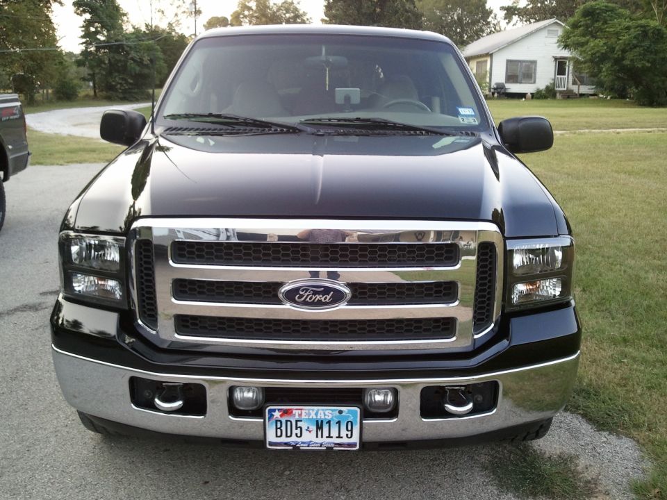 Black Ford Excursion front view with chrome grille and Texas license plate BD5-N119
