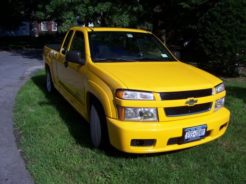 2005 Chevrolet Colorado - This yellow 2005 Chevrolet Colorado pickup truck is shown from a 3/4 front angle.